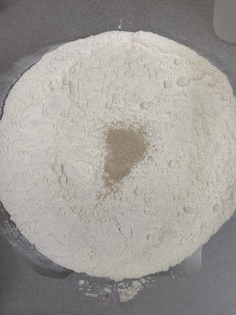 Bowl of flour, yeast, and salt.