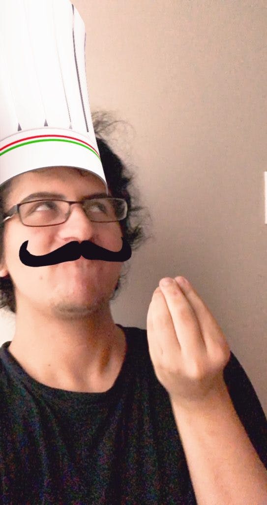 Toaster with a chef hat and mustache making a gesture with his hands asking "Why"